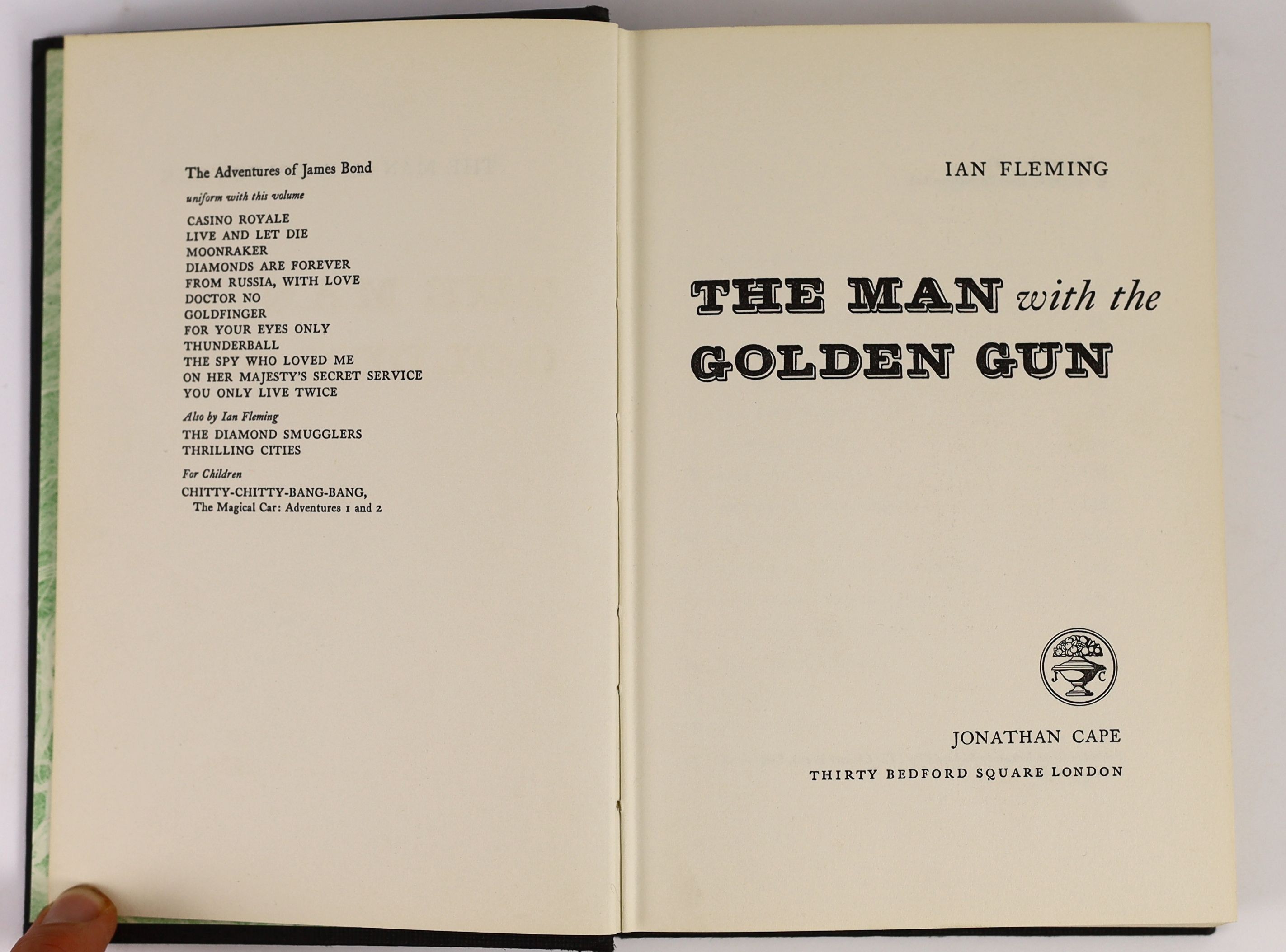 Fleming, Ian - The Man with the Golden Gun. 1st ed. Original publishers cloth with gilt letters direct on spine, original pictorial d/j. Green decorative end papers. 8vo. Jonathan Cape, London, 1965.